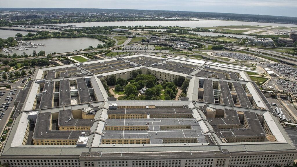 Aerial view of the five-sided Pentagon building beside the Potomac River